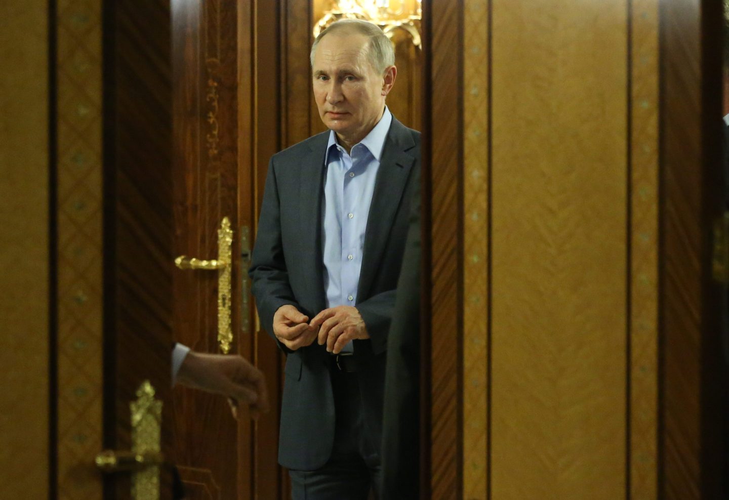Russian President Vladimir Putin enters a hall during Russian-Belarusian talks in Sochi, Russia, February 7, 2022.