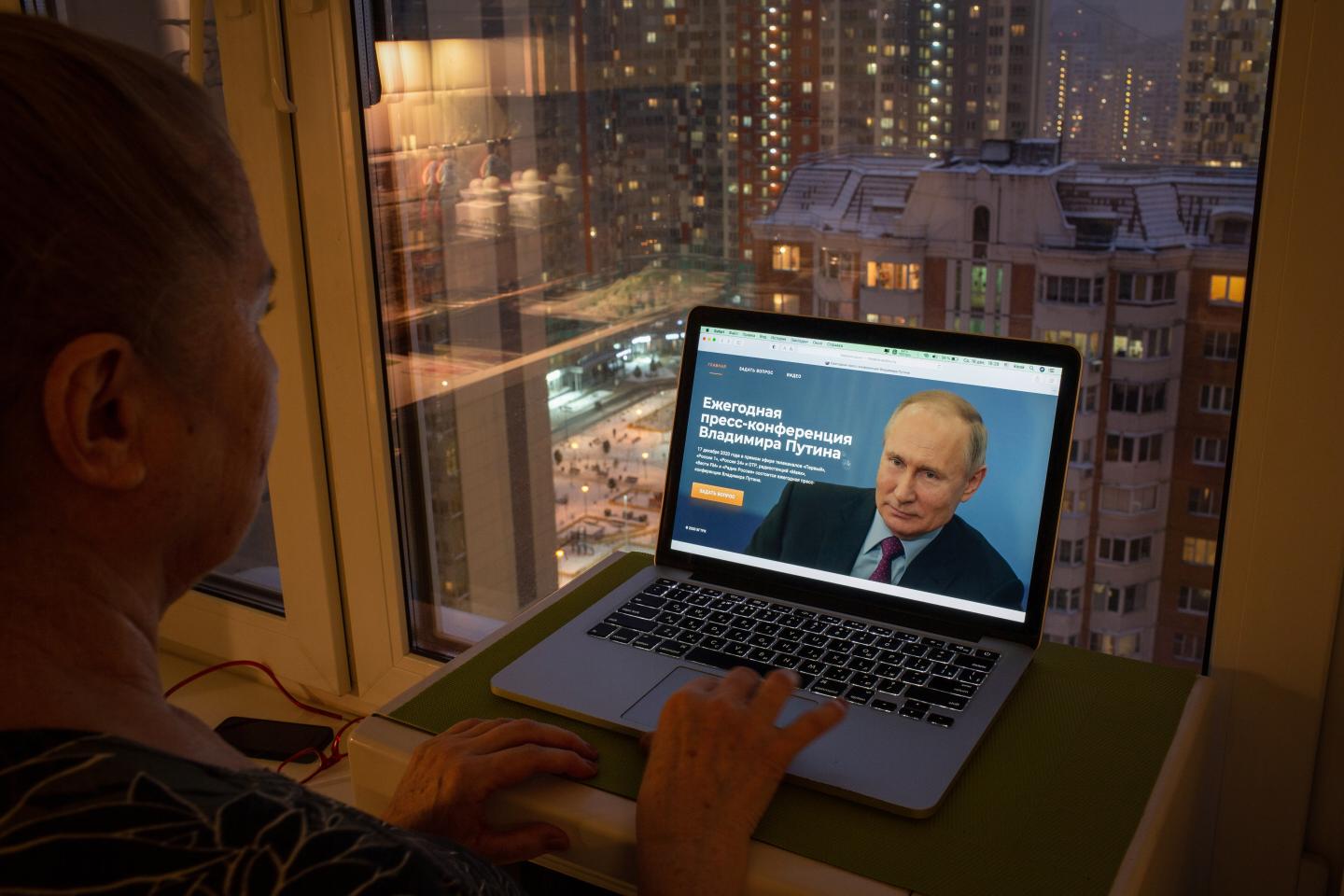 A resident uses a laptop computer to browse the website https://moskva-putinu.ru/, where users can submit a questions to Vladimir Putin, Russia's President, to answer during his annual news conference, in Moscow, Russia, on Wednesday, Dec. 16, 2020.