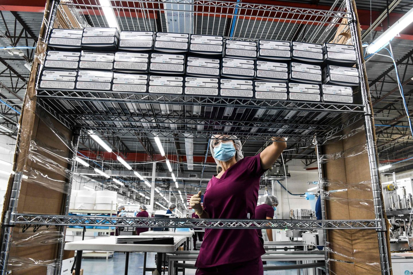 A woman working in a respiratory mask equipment factory.