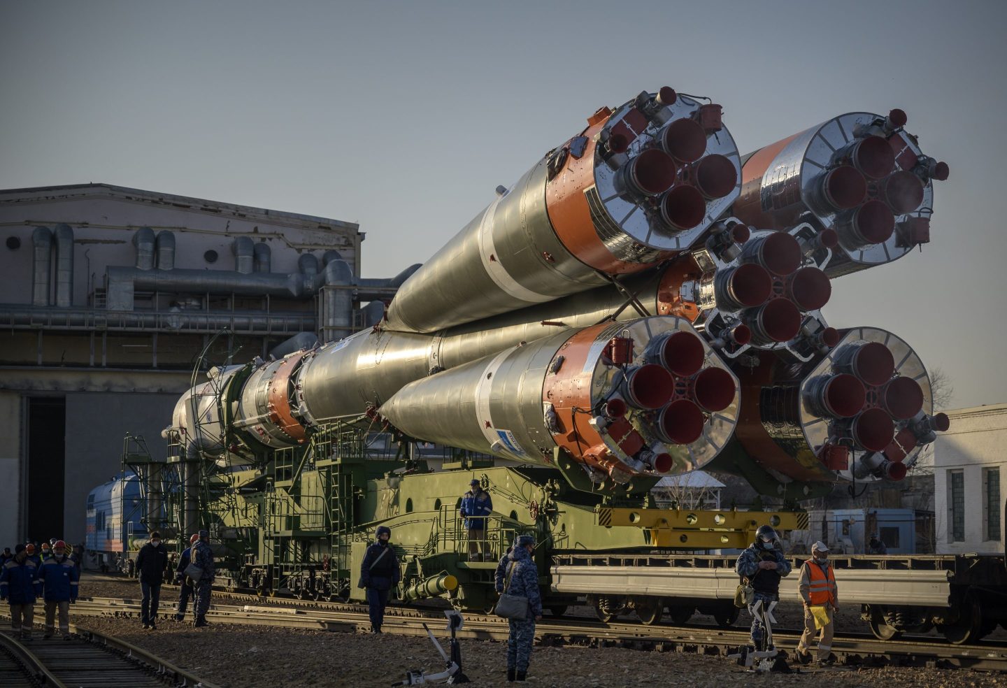 A Soyuz rocket is rolled out of a hanger in Baikonur Cosmodrome