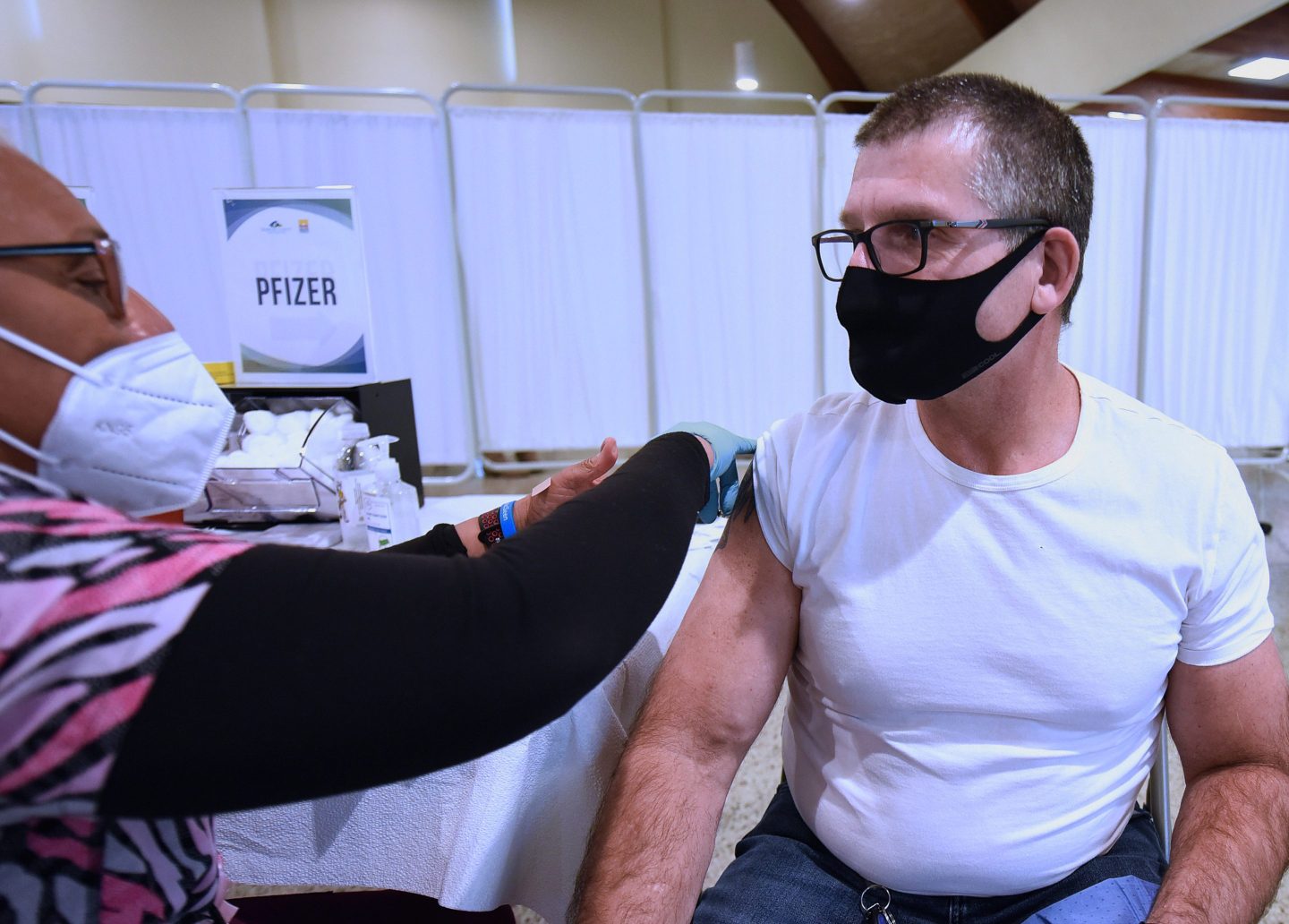 Man receives Pfizer COVID vaccine