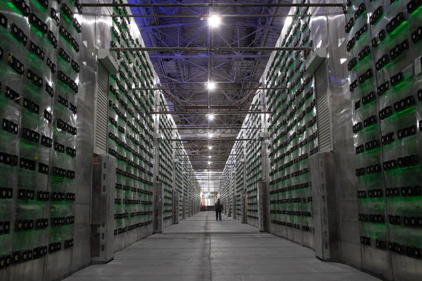 Racks of mining rigs at the Minto cryptocurrency mining center in Nadvoitsy, Russia, on Friday, Dec. 17, 2021. Experts say it's unlikely that the Kremlin can evade sanctions using crypto for several reasons, including it's traceability.