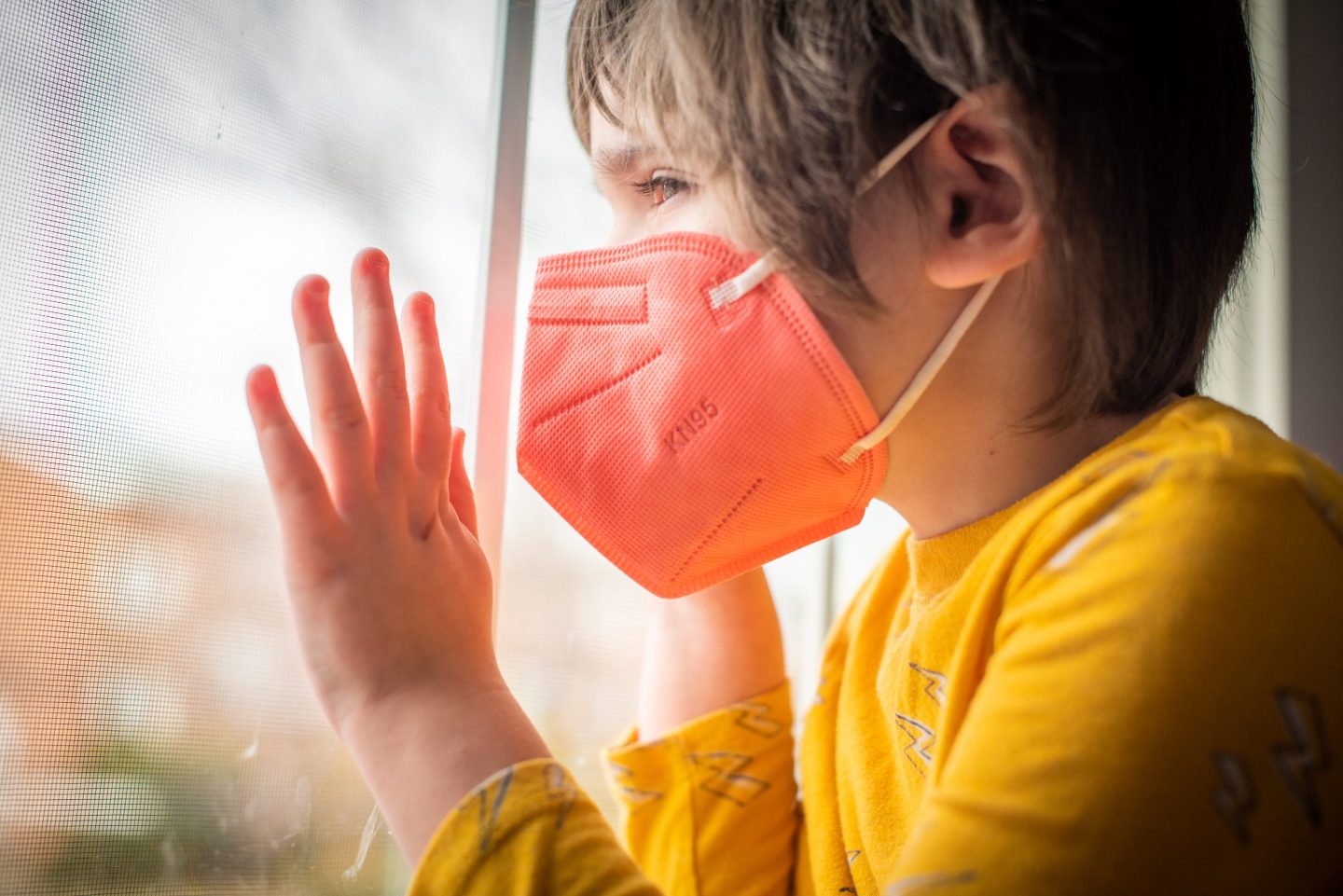 A child wears a KN95 mask