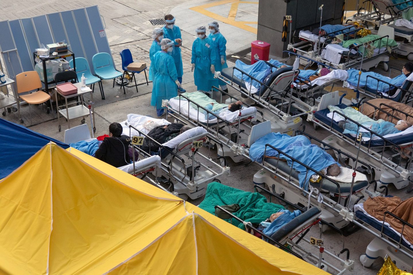 Patients are left in beds outside hospitals in Hong Kong.