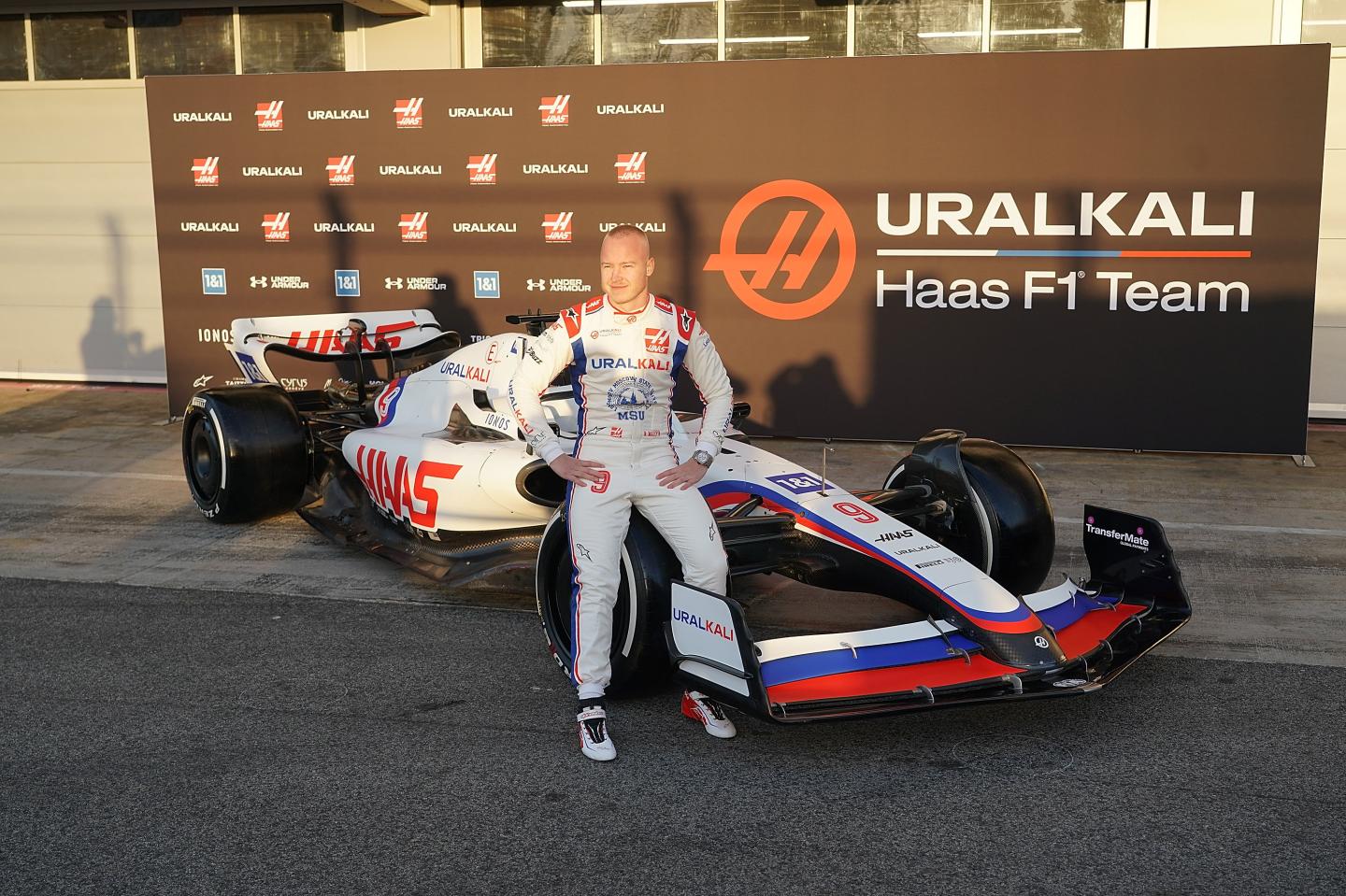 Nikita Mazepin poses for picture with new car by Uralkali Haas F1 Team.