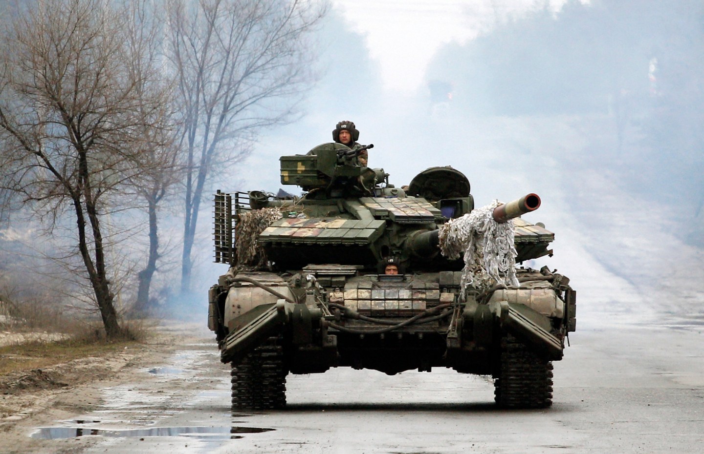Ukrainian servicemen ride on tanks towards the front line with Russian forces in the Lugansk region of Ukraine.