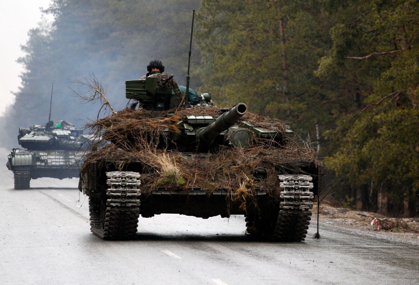 Ukrainian tanks move on a road before an attack in Lugansk region