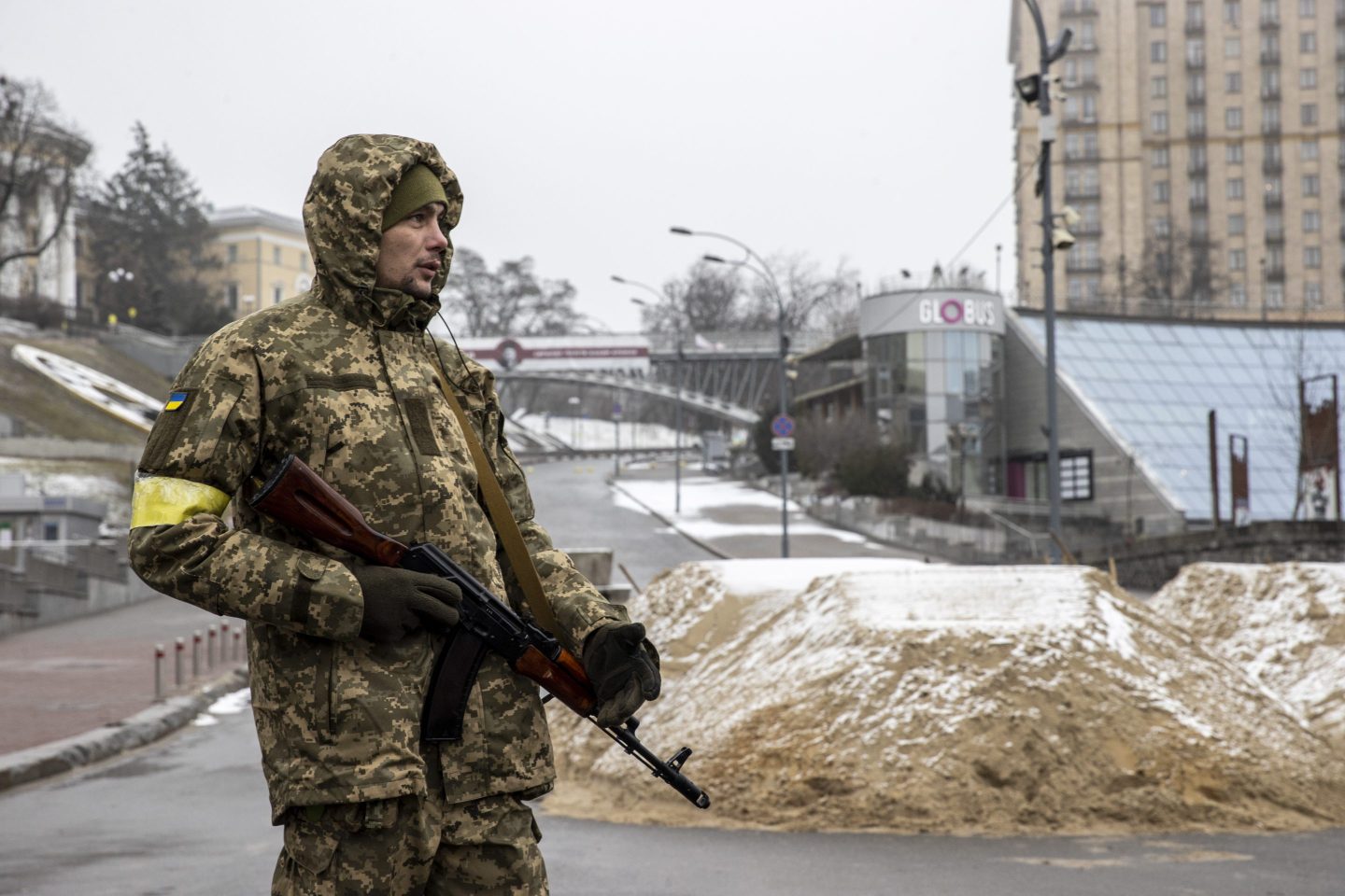 A soldier is seen around piles of sand used for blocking a road in Ukrainian capital, Kyiv, amid Russian attacks on March 2, 2022.