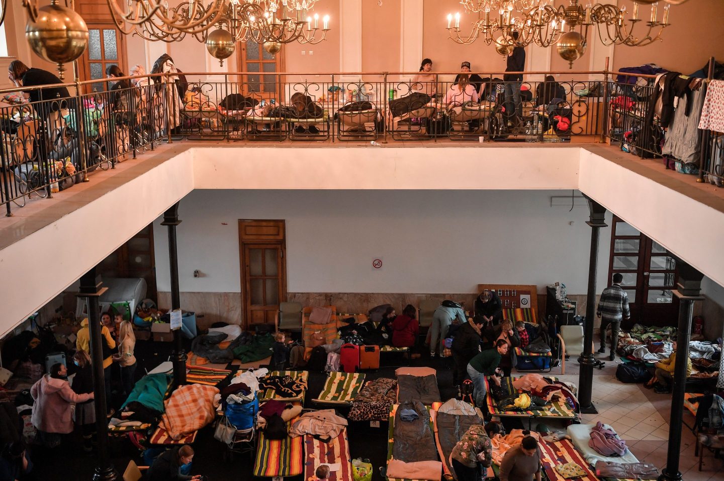 Refugees from Ukraine rest at a temporary shelter in the main train station of Krakow on March 6 as they wait to be relocated in Poland or abroad. The number of people fleeing Russia’s invasion of Ukraine has reached 4 million, according to UN agencies.