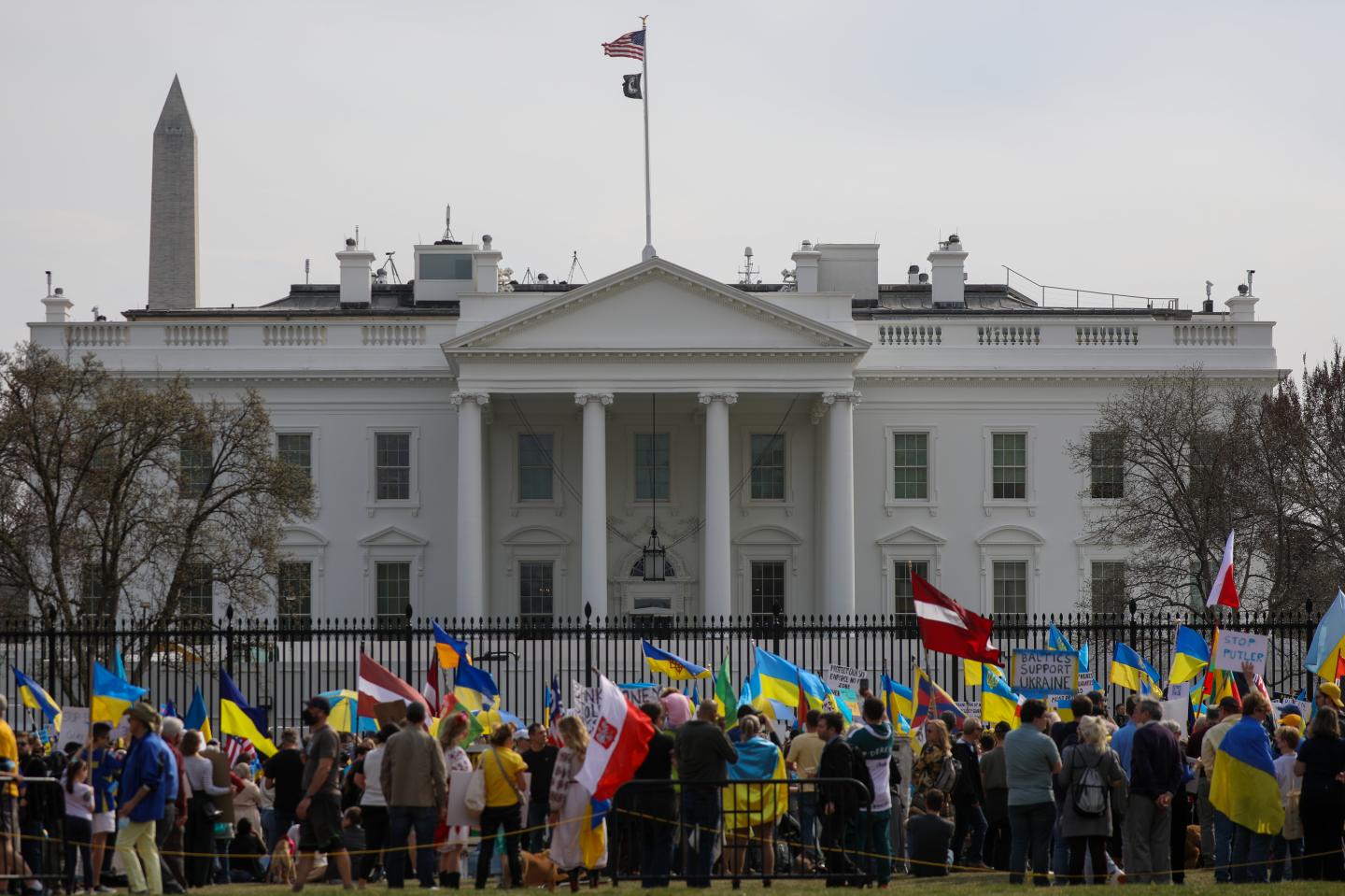 People gather in front of the White House to protest against Russia's attacks on Ukraine.