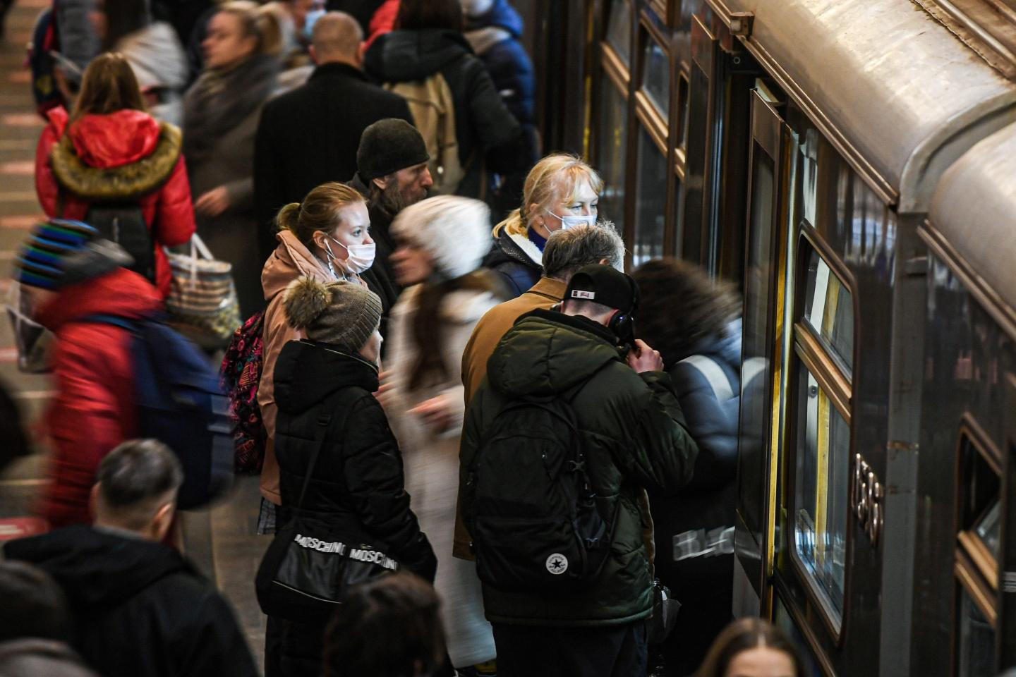 Passengers board a subway in Moscow.