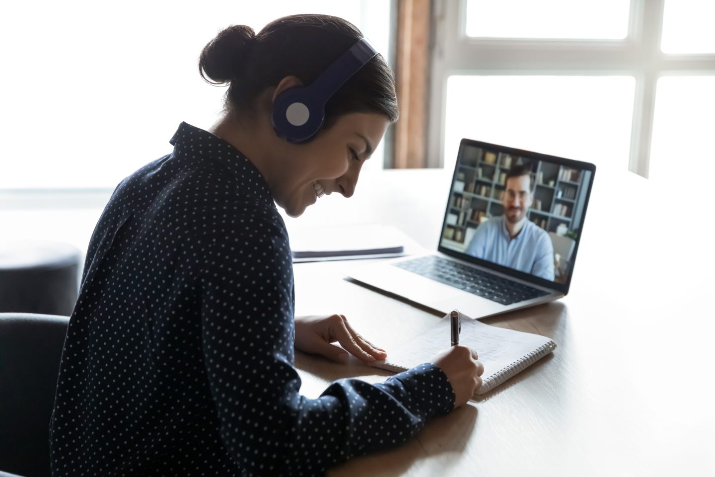 An employee attends a meeting online