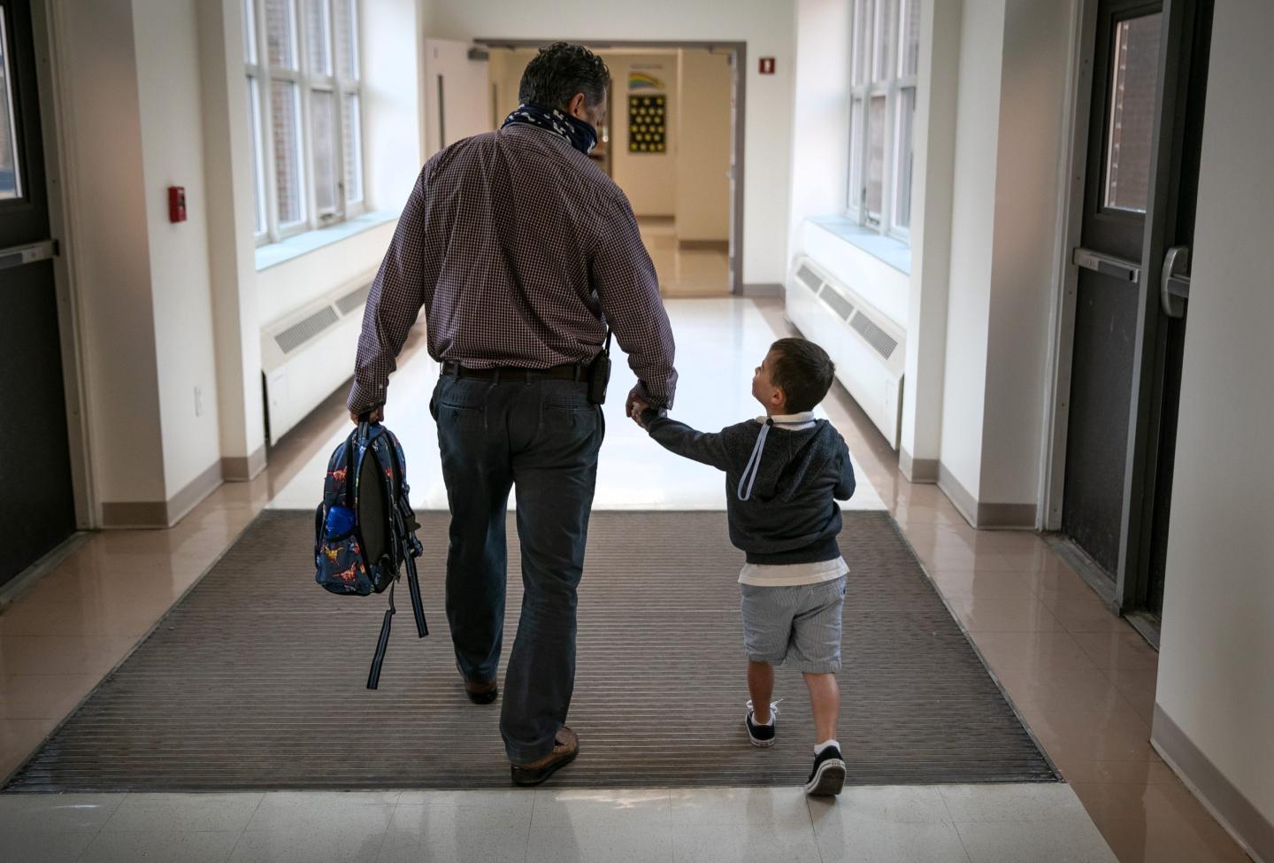 Father dropping off son at school