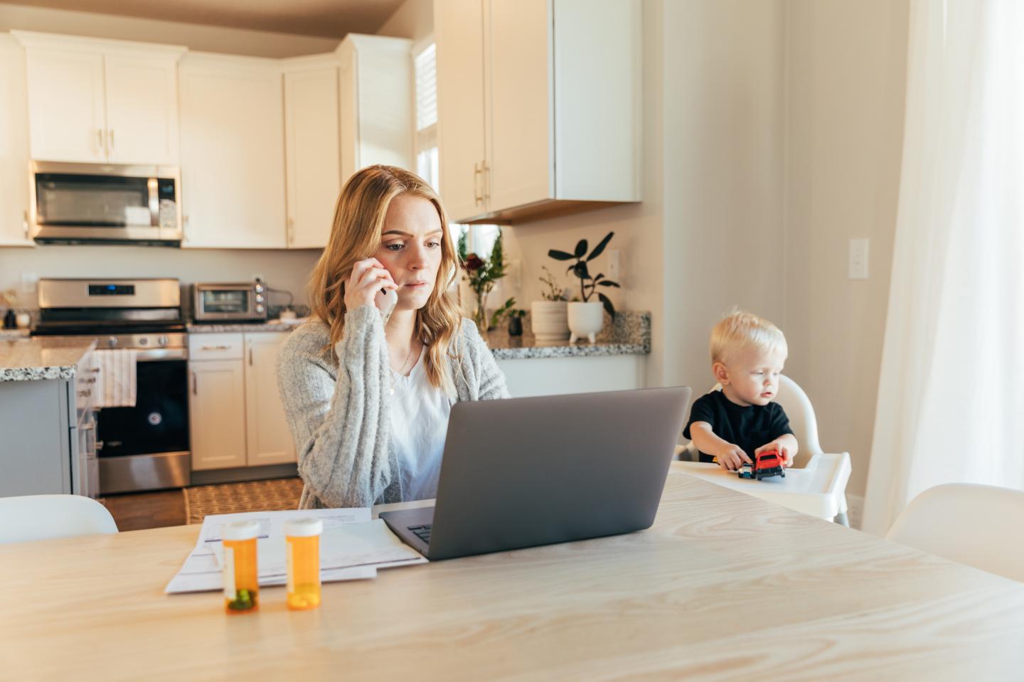 Mother on hold with medical provider