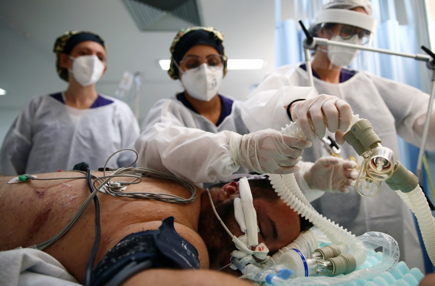 Health care workers in Brazil treat a coronavirus patient