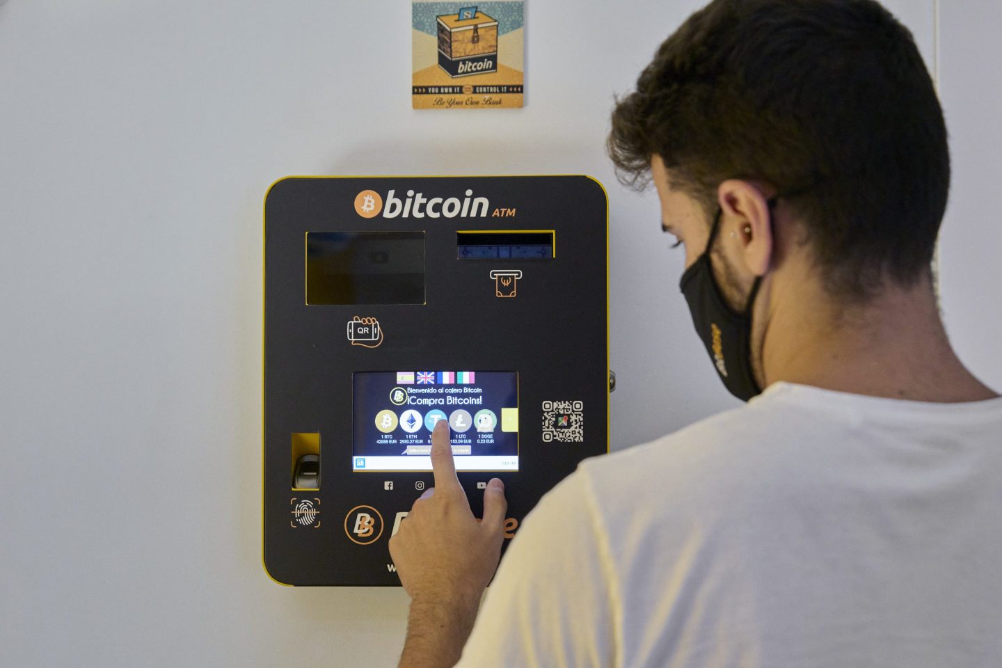 A man using a Bitcoin ATM.