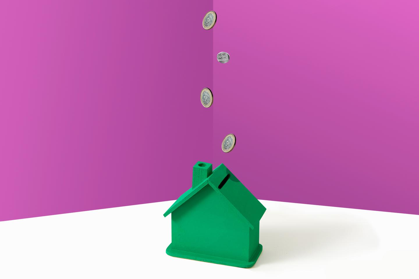 Artist’s rendering of a hand dropping coins into a bank shaped like a house