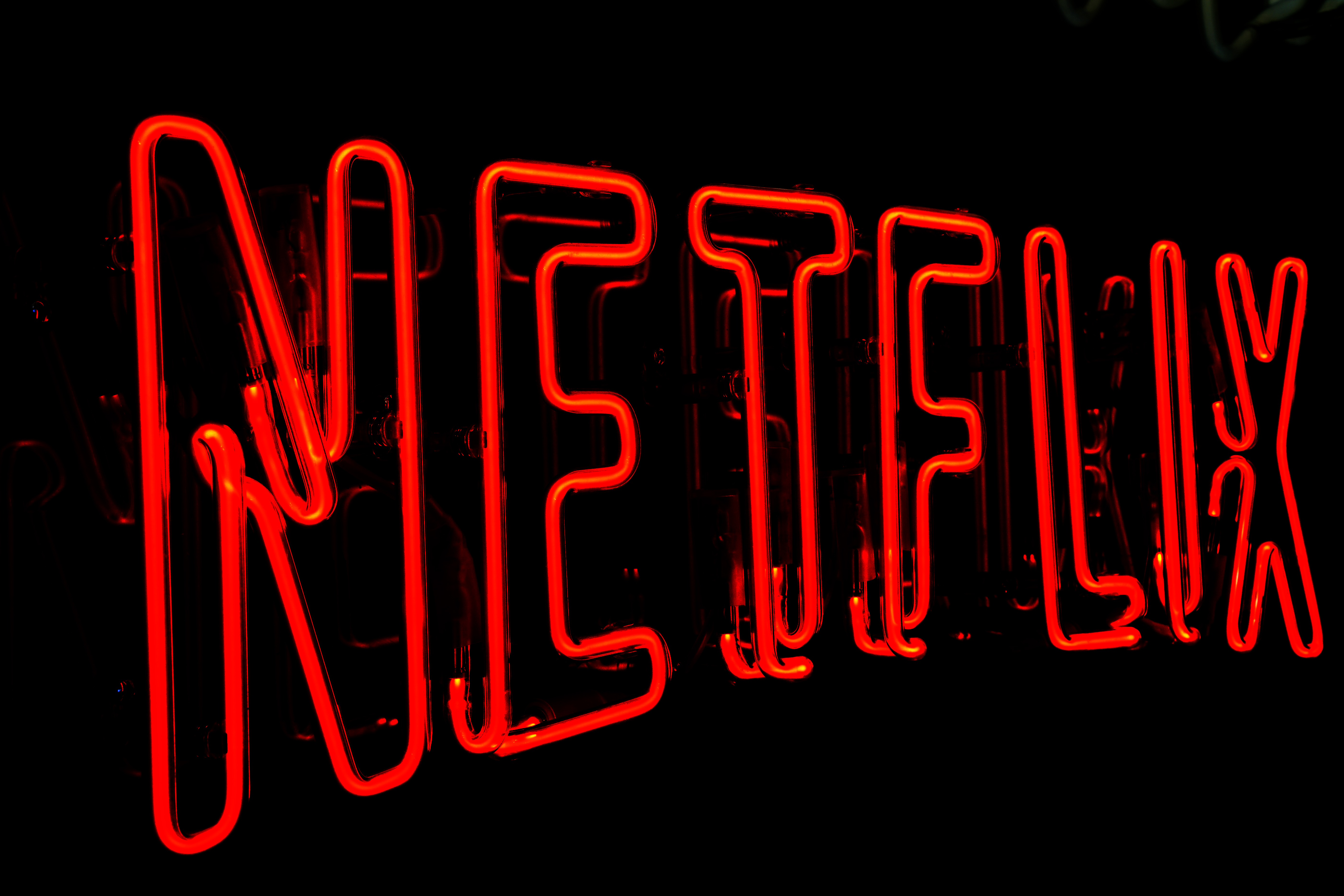 A Netflix logo is seen during the HOM temporary store opening to launch the new HOM Collection, the first line of home products for LGBT and families, as Netflix promotes the movie 'Il Filo Invisibile' on March 03, 2022, in Milan, Italy. Netflix announced Sunday that it was shuttering operations in Russia, one of the largest media companies to do so since the invasion.