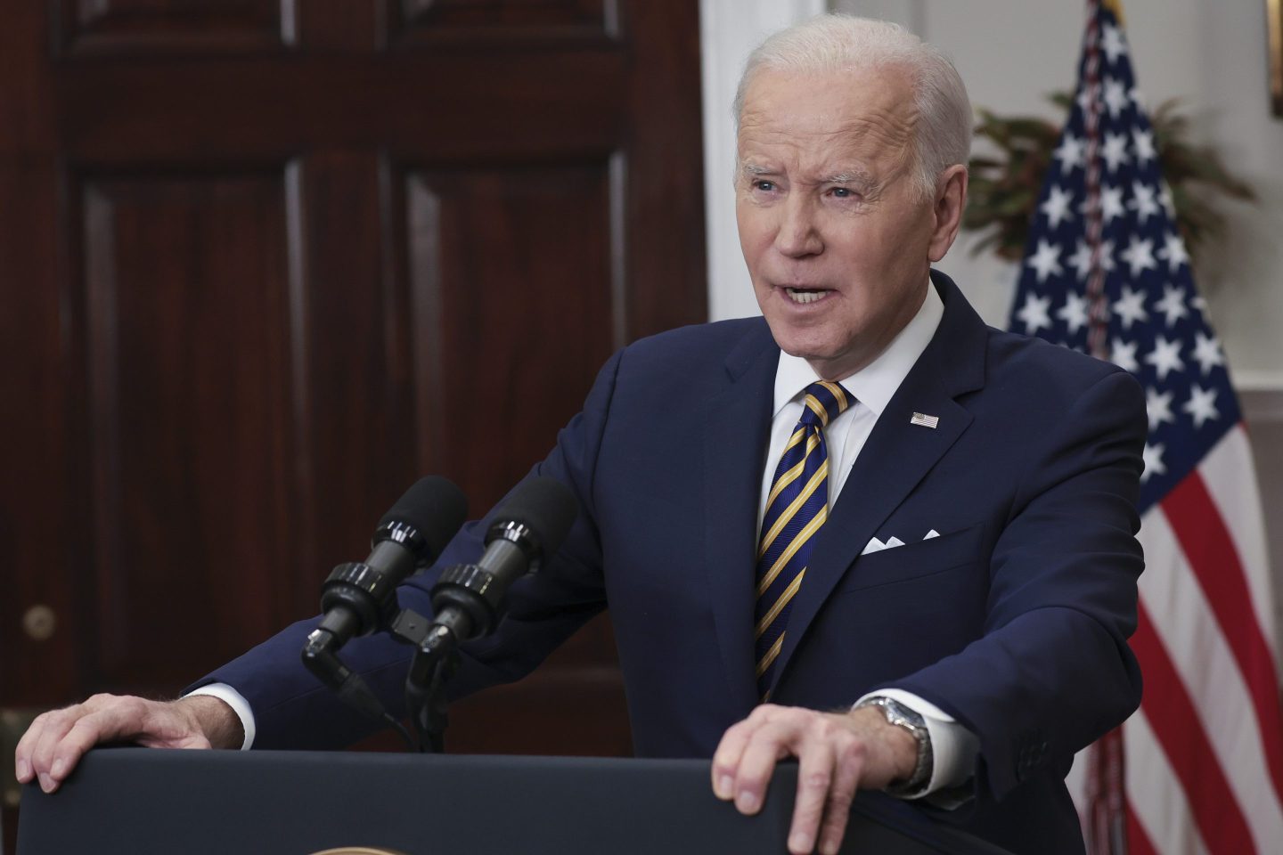 U.S. President Joe Biden delivers a speech at a podium