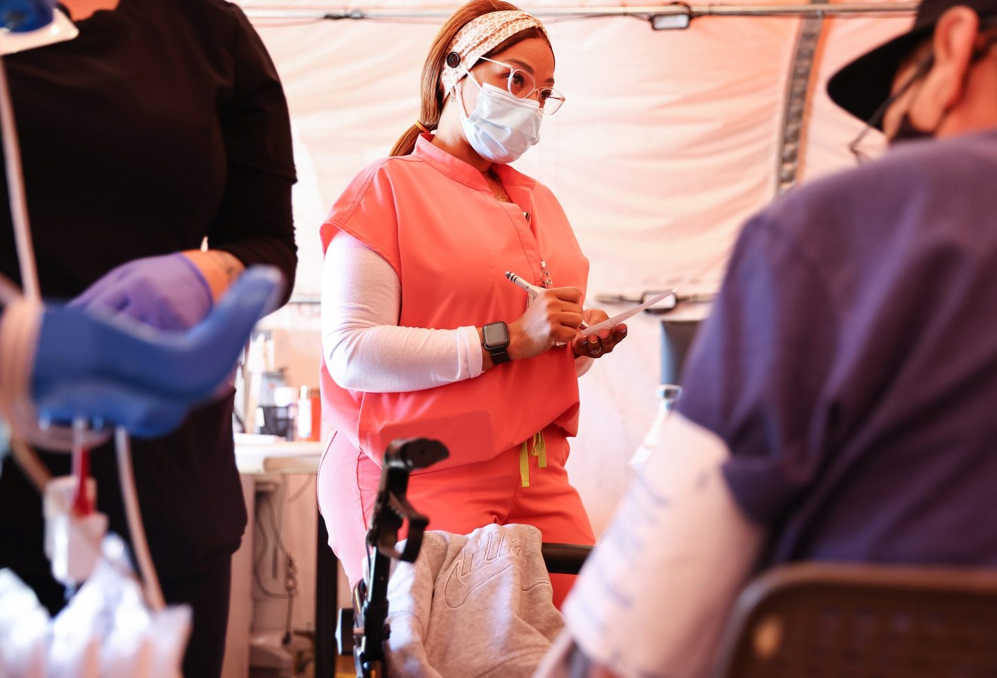 Registered nurse Kaila Cunningham works in the triage tent at Providence St. Mary Medical Center