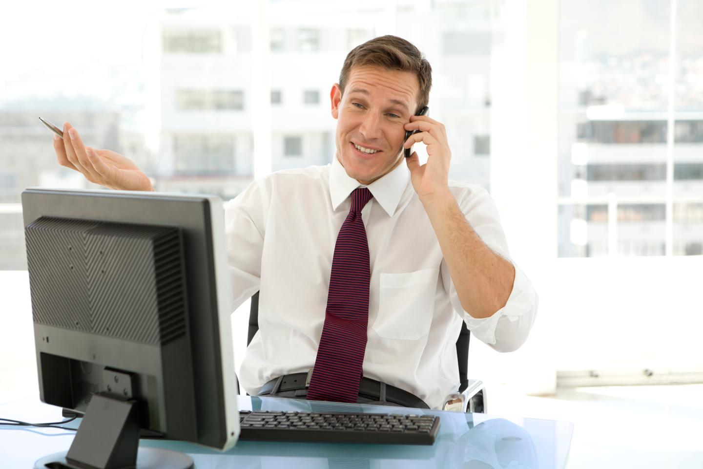 Salesman on the phone at workplace