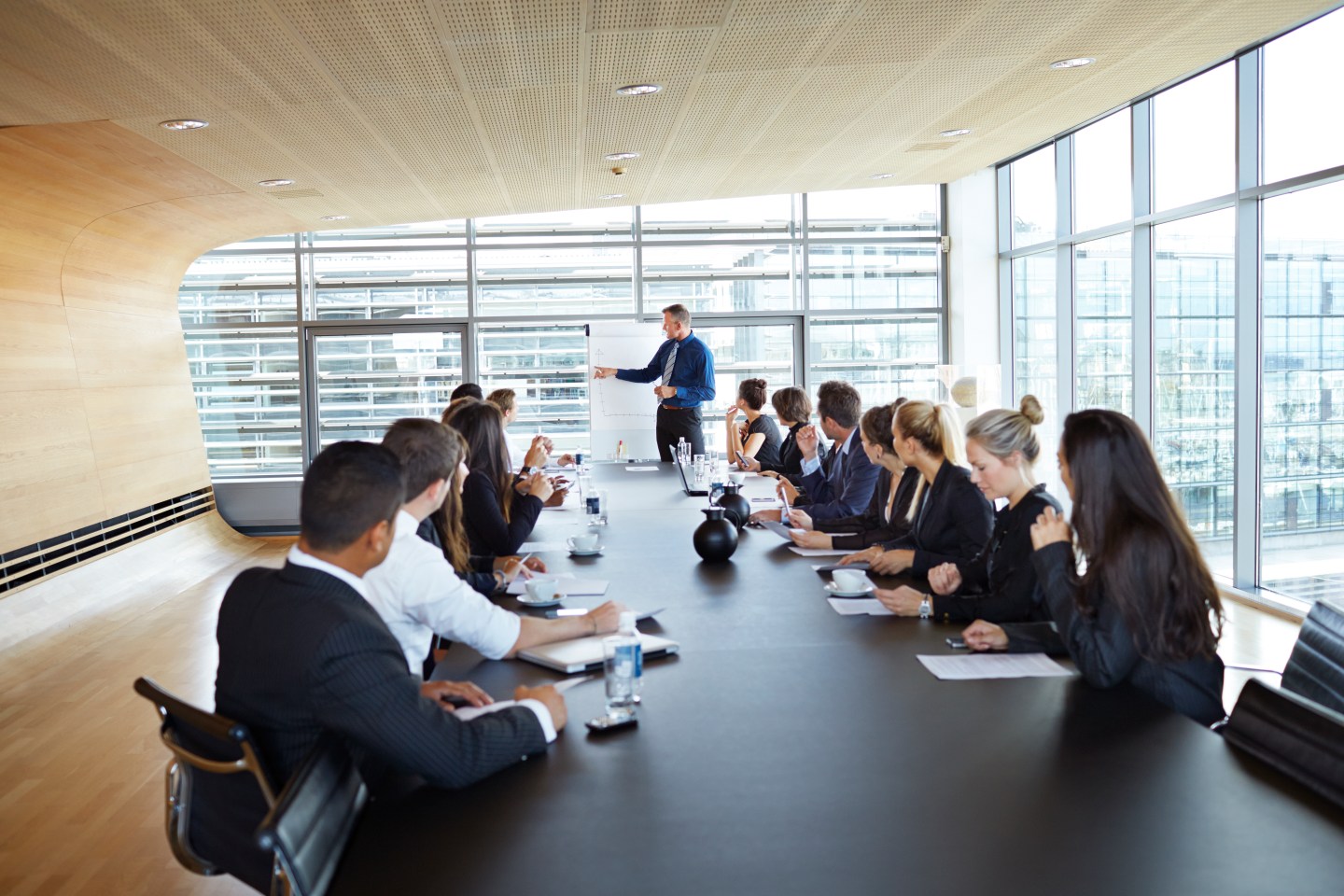 People sitting at a long table.