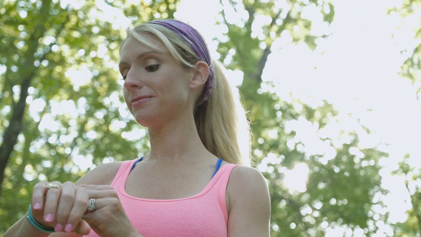Woman checking her Fitbit