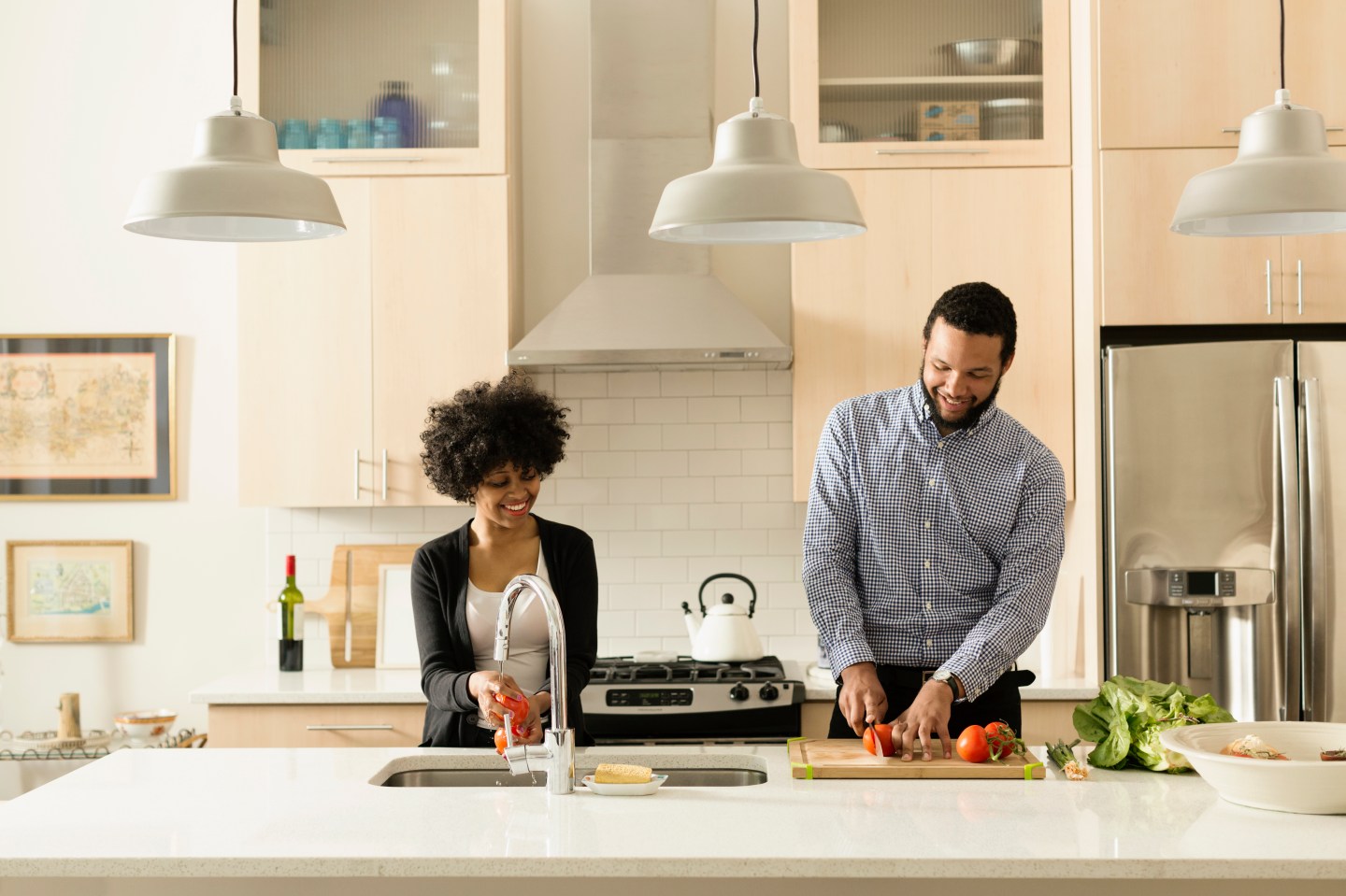 Woman and man cooking together in a kitchen