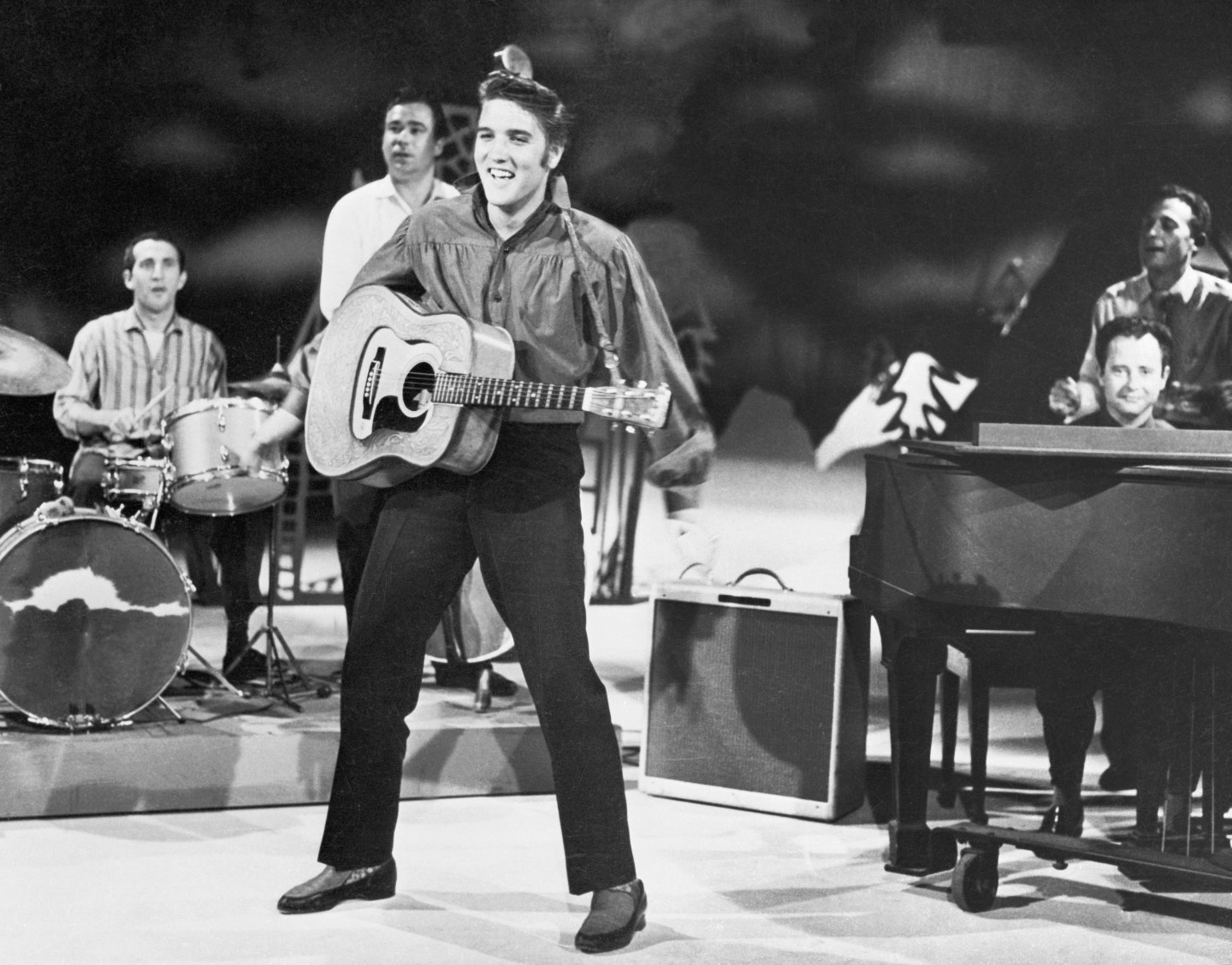 Elvis Presley, rock and roll sensation, as he rehearses with his band for "The Ed Sullivan Show."