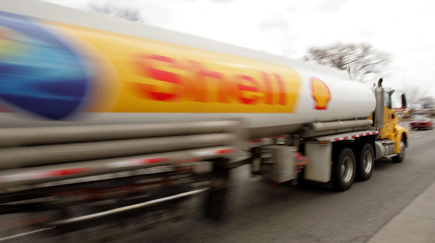 A Shell Oil tanker truck moves down a street