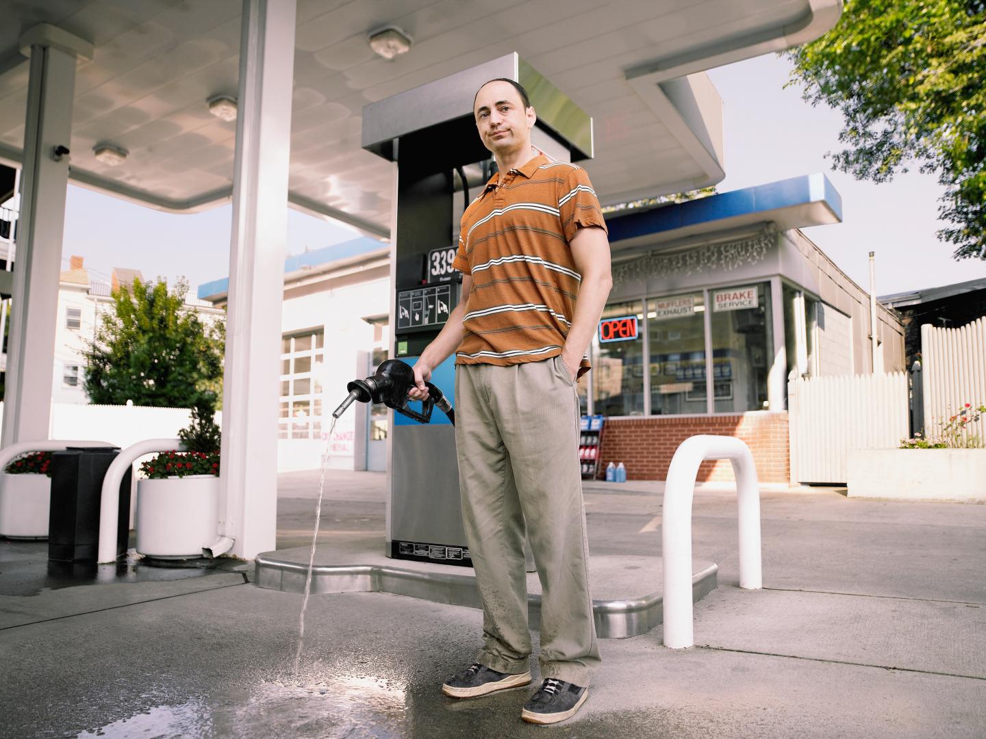 Man standing near a fuel pump