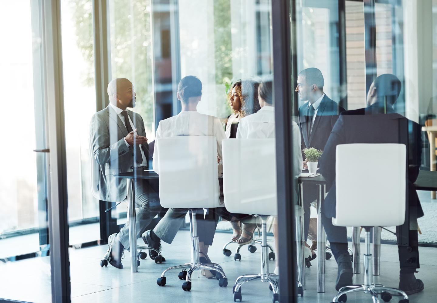 Shot of a team of professionals having a meeting in the boardroom at work