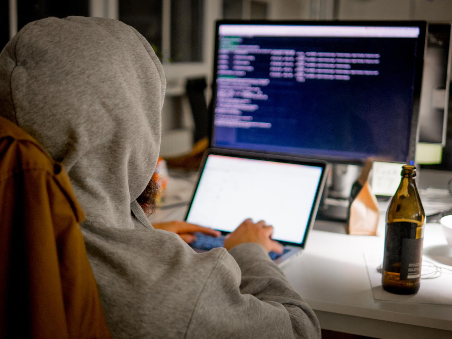 Rear View Of Computer Hacker
