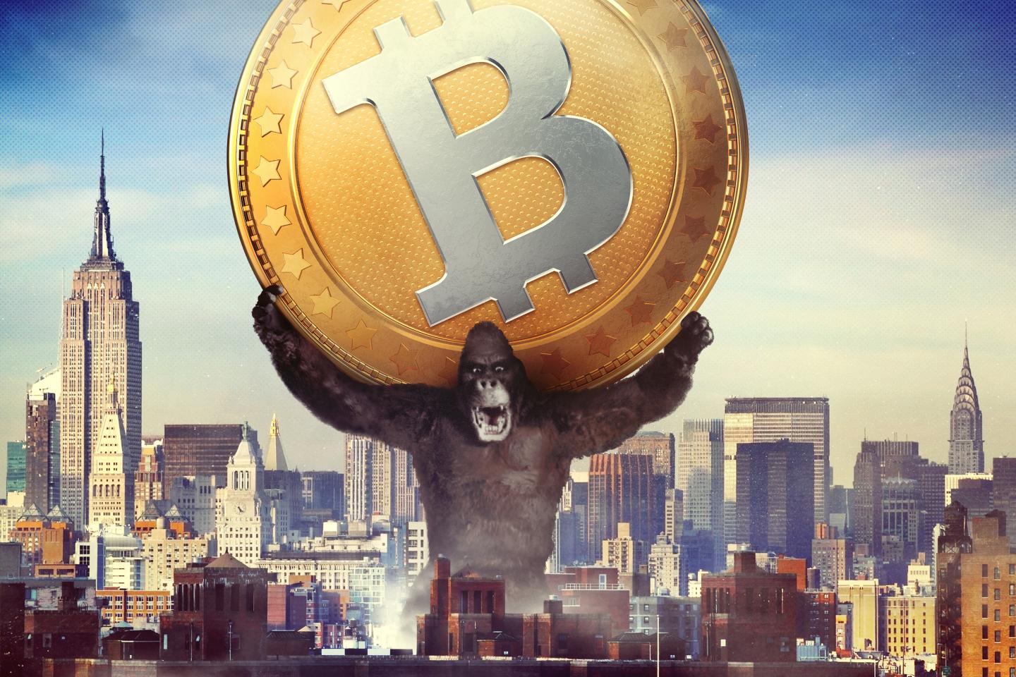 King Kong holding a massive Bitcoin over the New York City skyline.