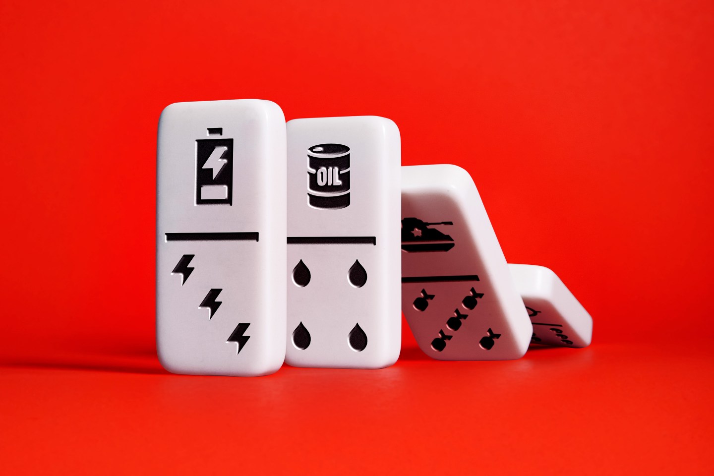 Photo illustration of dominos falling.