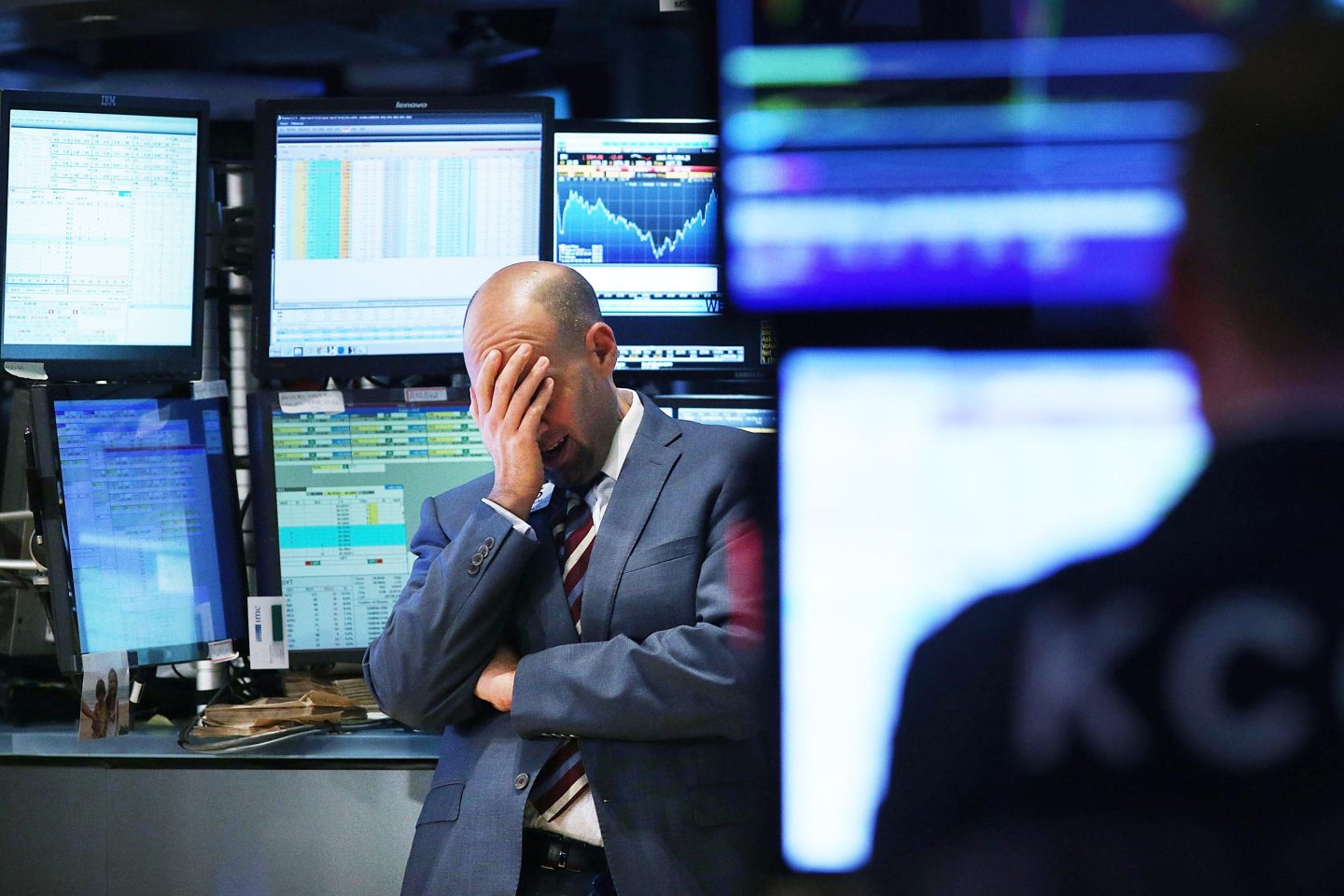 A stock trader gets disappointing news on the floor of the New York Stock Exchange.