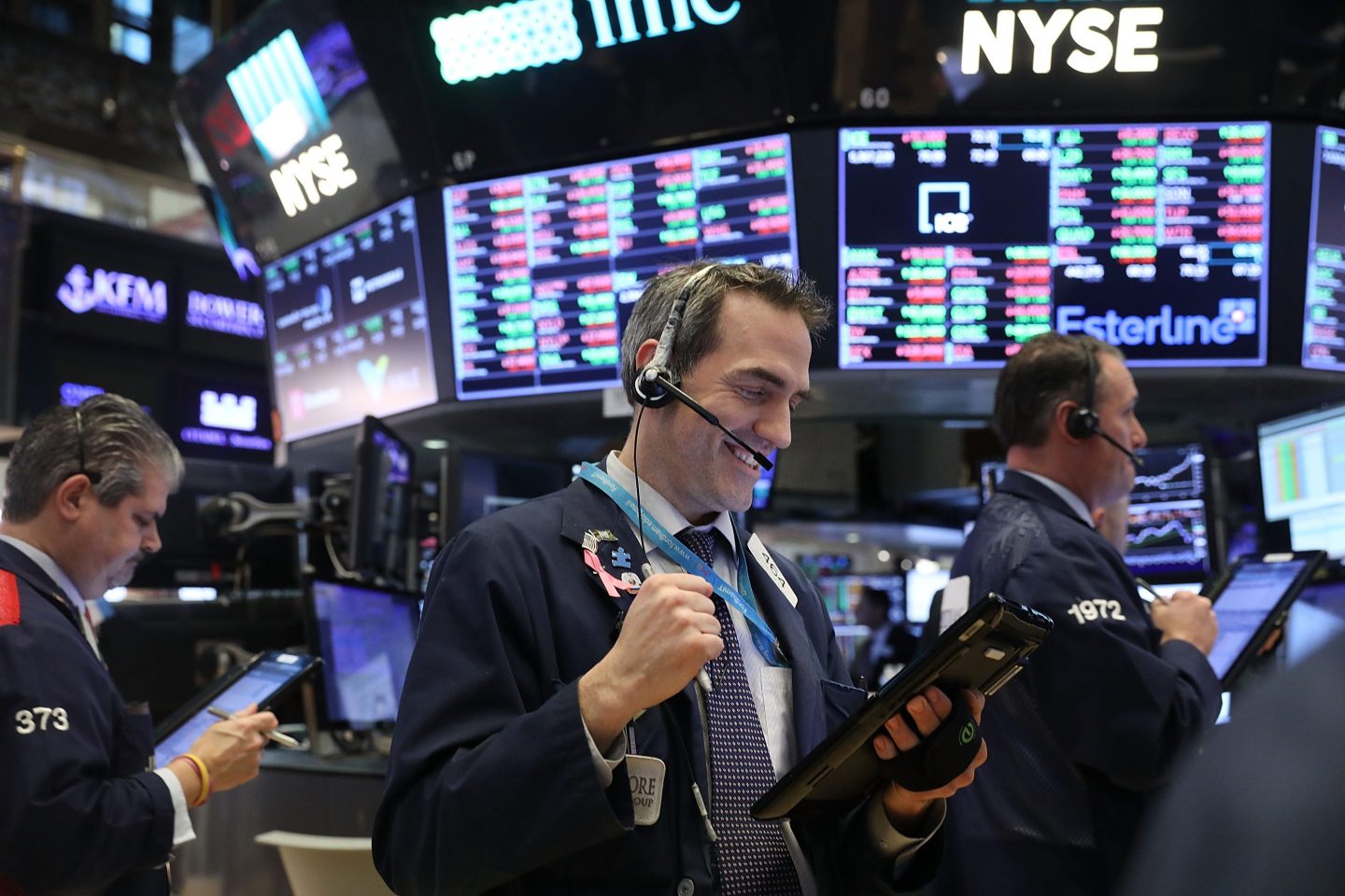 A stock trader celebrates on the floor of the New York Stock Exchange.