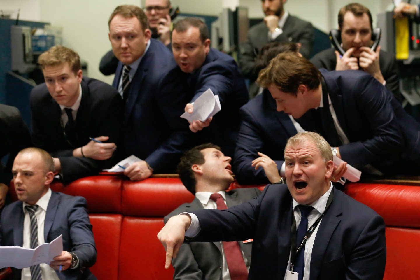 Traders bark orders from red couches at the London Metal Exchange.