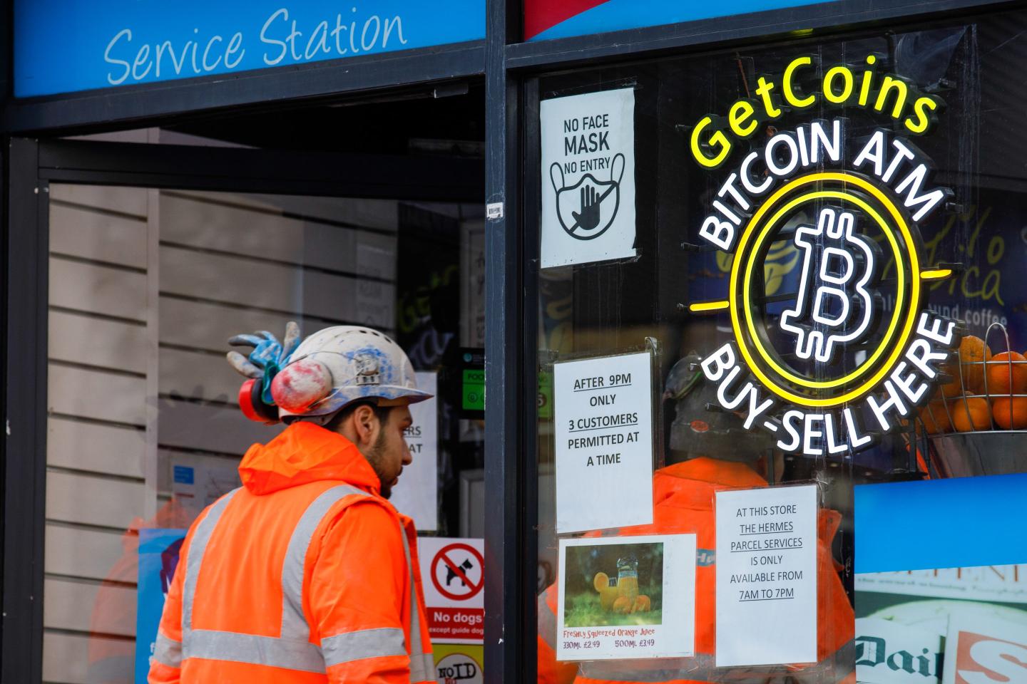A man walks into a store with a Bitcoin ATM.
