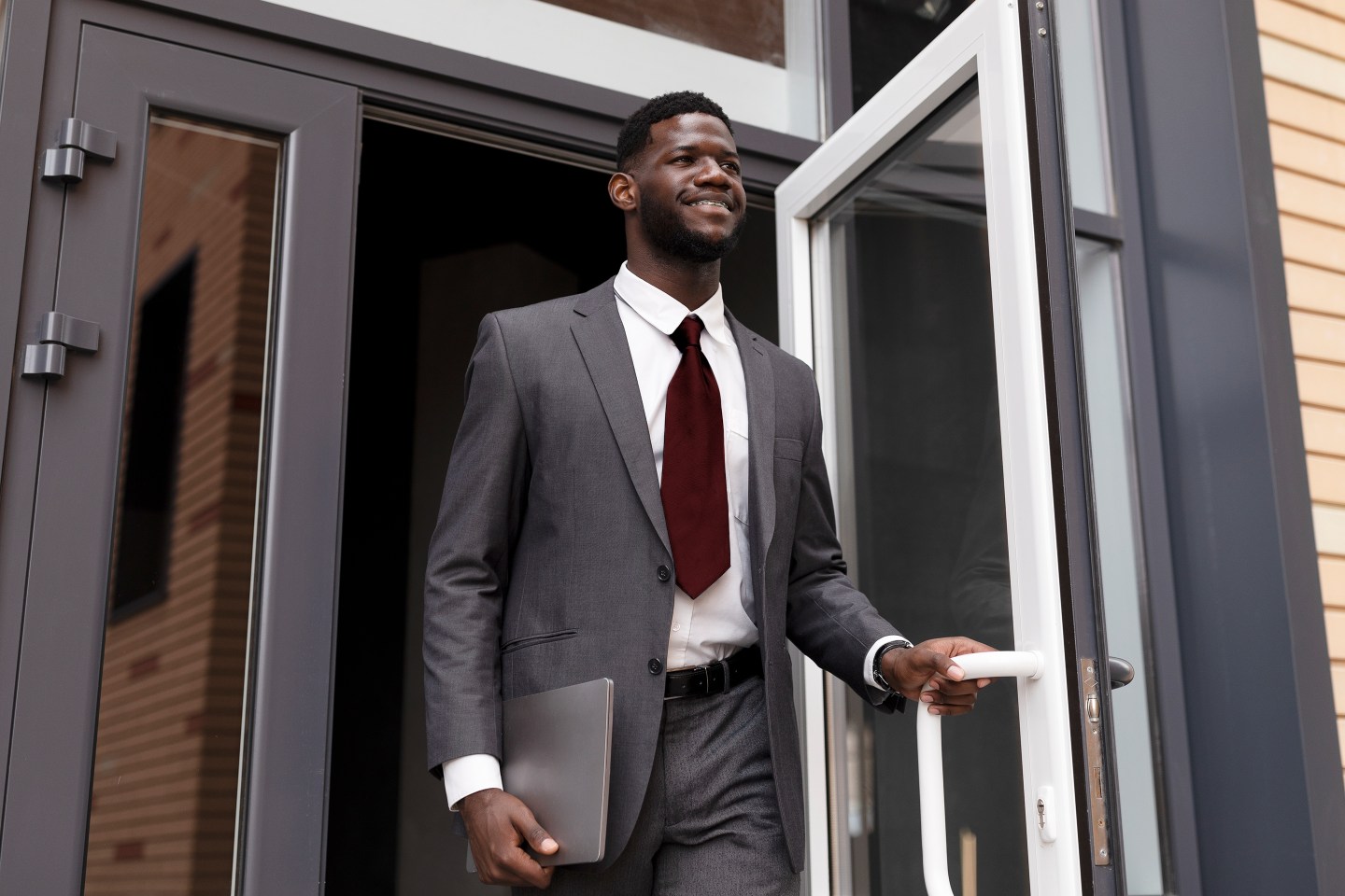Man walking out of office building