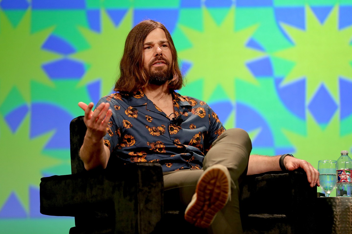 Dan Price speaks onstage at SXSW 2022.