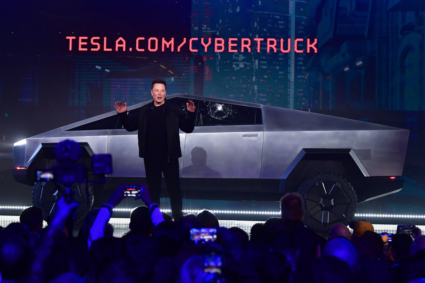 Elon Musk speaks in front of the Cybertruck.