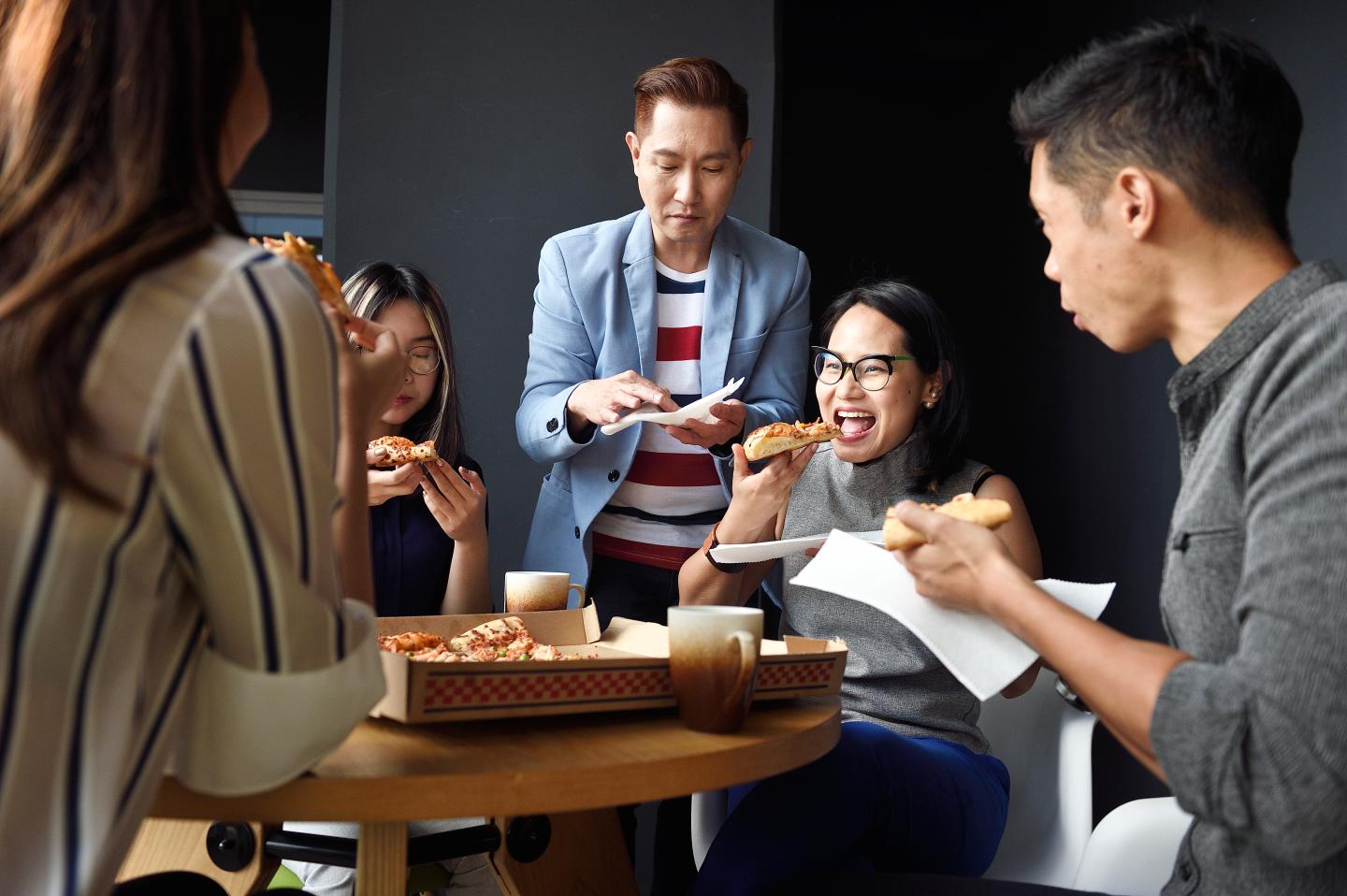 work friends eating pizza