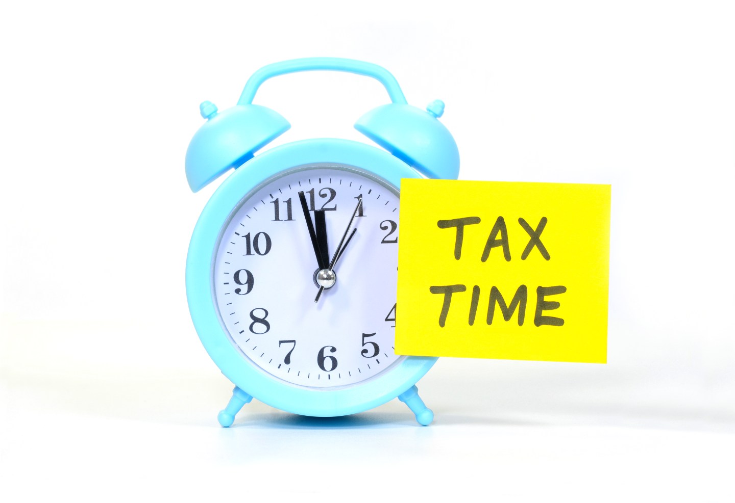 ConTax Time text on a yellow sticky note on an alarm clock.