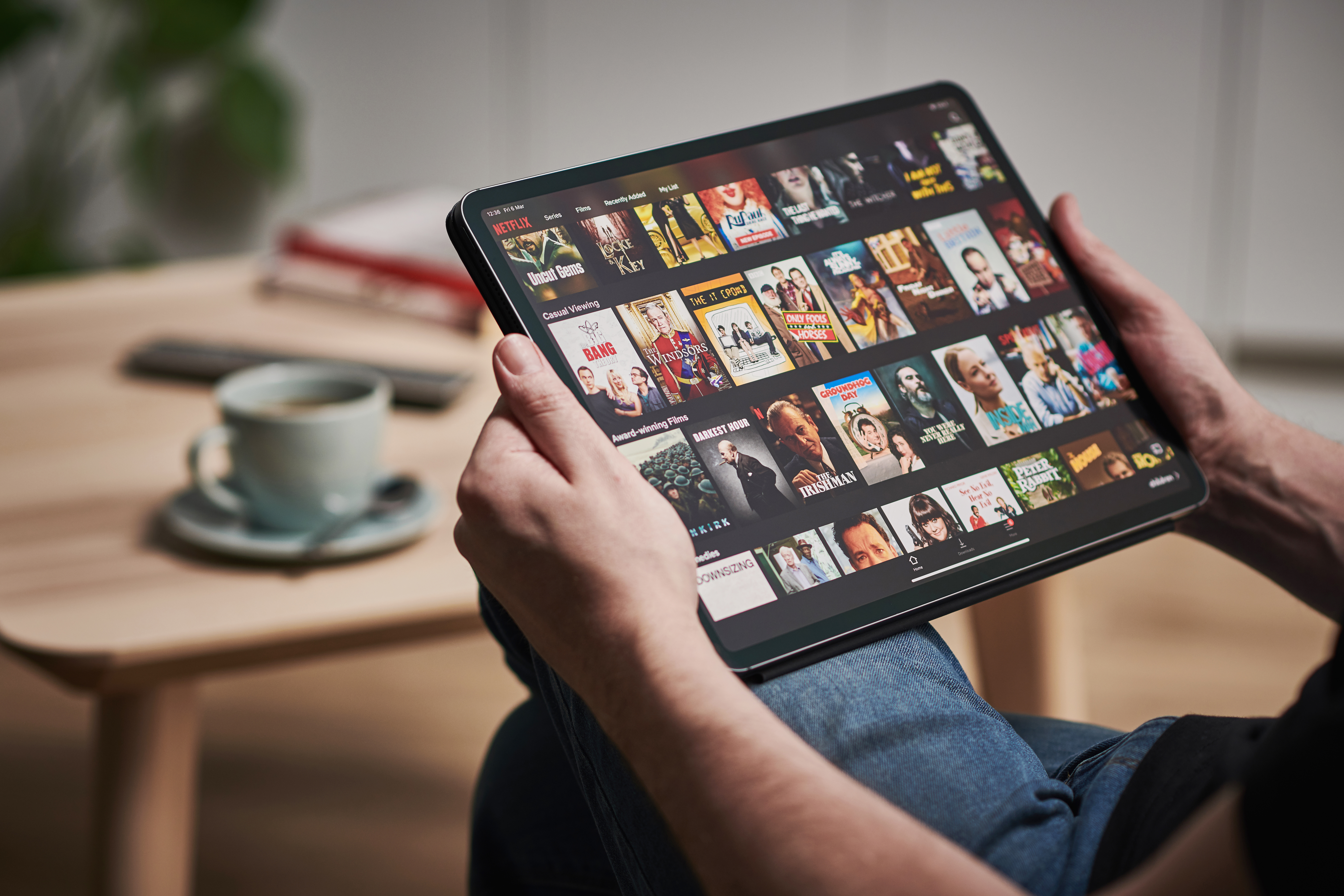 Man watching Netflix on an iPad