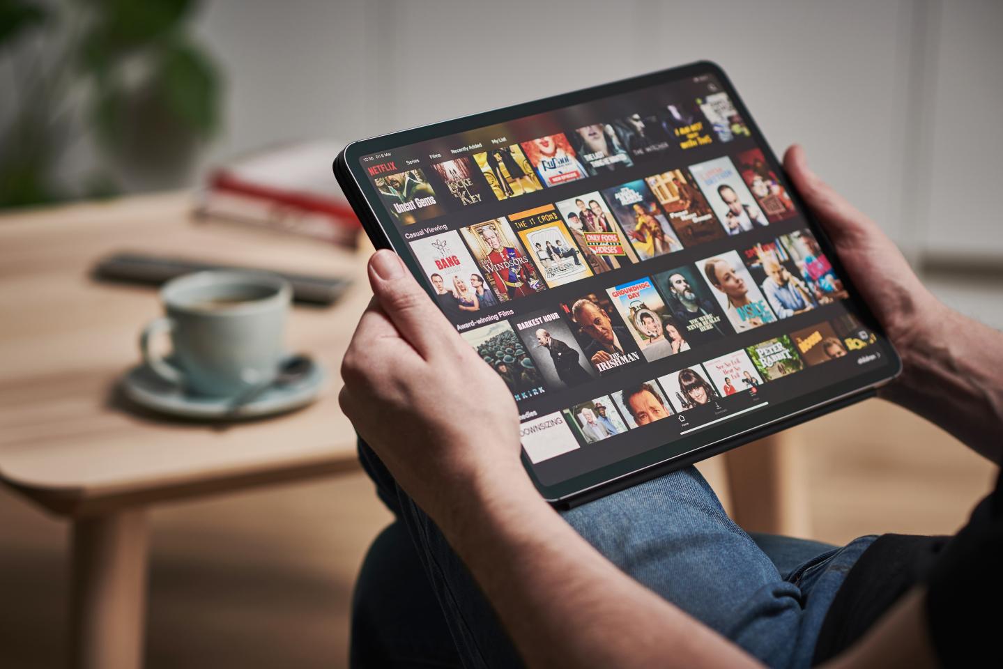 Man watching Netflix on an iPad