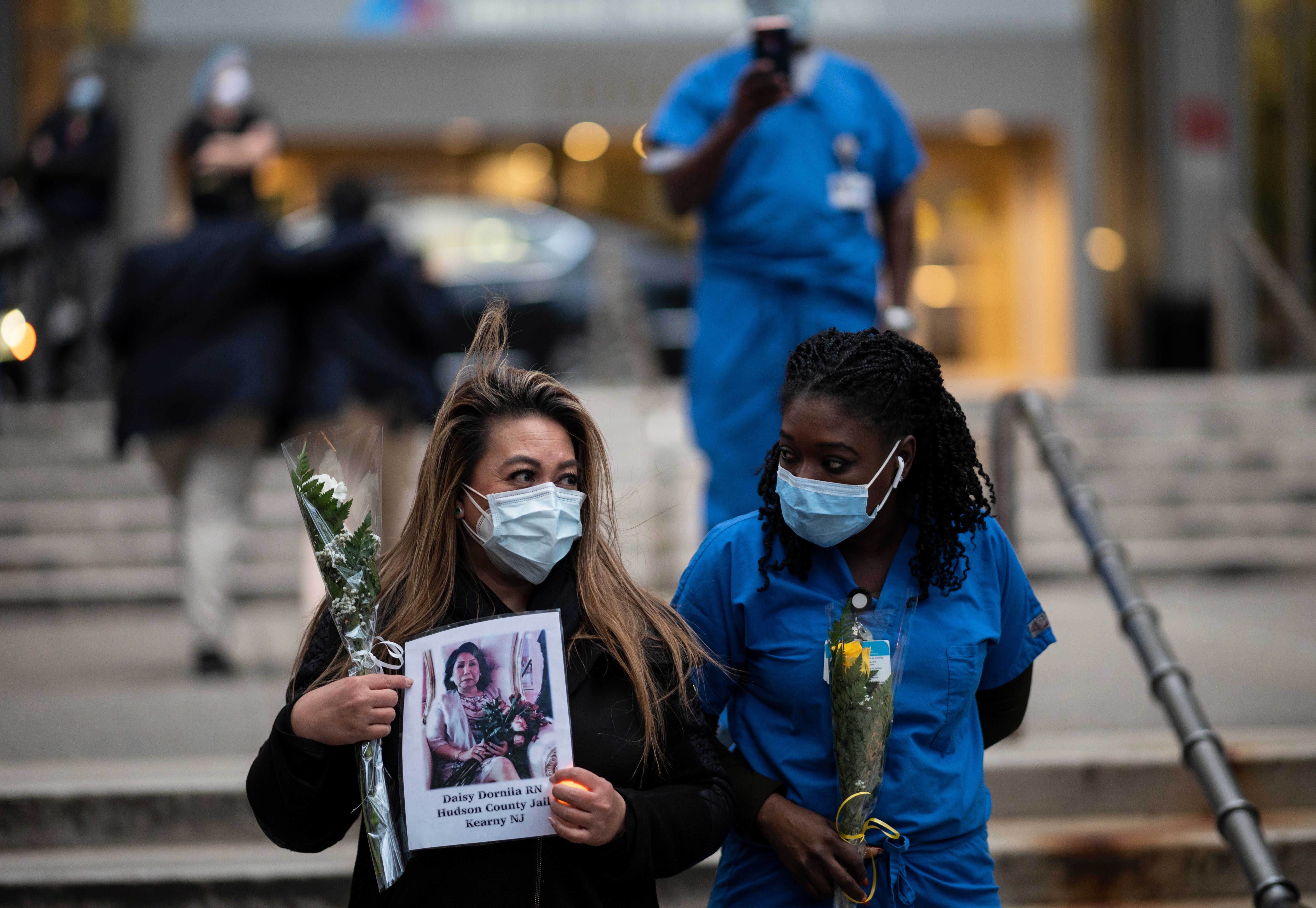 Nurses and healthcare workers remember their colleagues who died of the virus during a demonstration outside Mount Sinai Hospital in Manhattan on Apr. 10, 2020, in New York City. 