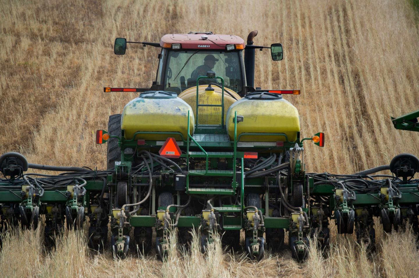 A farmer in Maryland plants corn