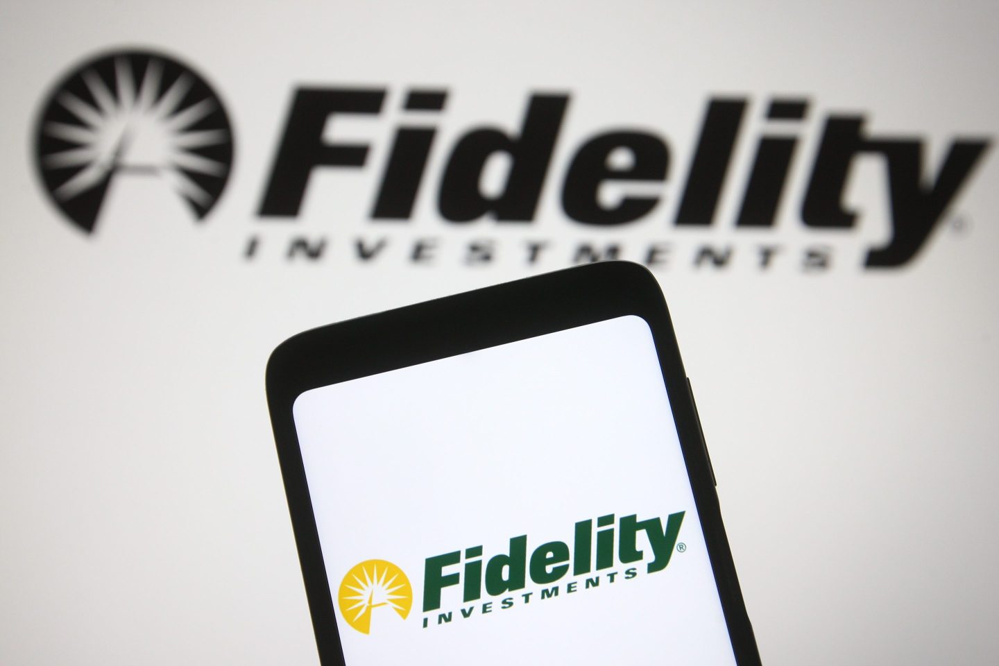 Photo illustration of the Fidelity app on a smartphone