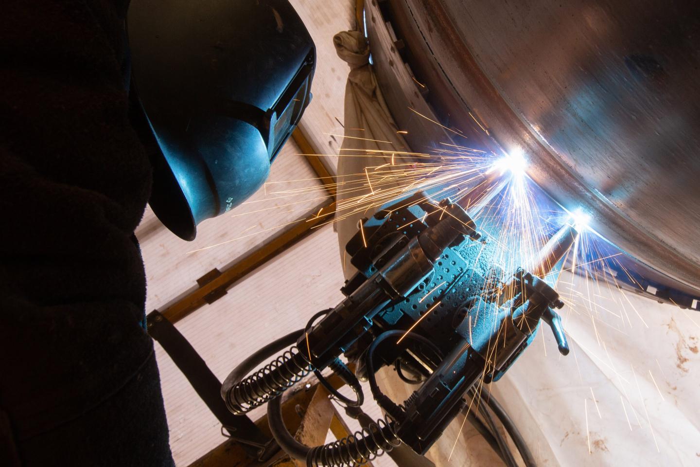 A worker welds a section of pipework on the Power of Siberia gas pipeline.
